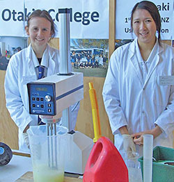 Phoebe McInerney (left) and Megan Seto of Ōtaki College with the emulsion fuels blending technology