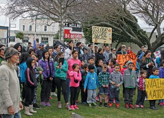Listening to the speakers, some of the 150 crowd at the TPPA hikoi at the Memorial Park (Photo Margaret Andrews. Click for full size)